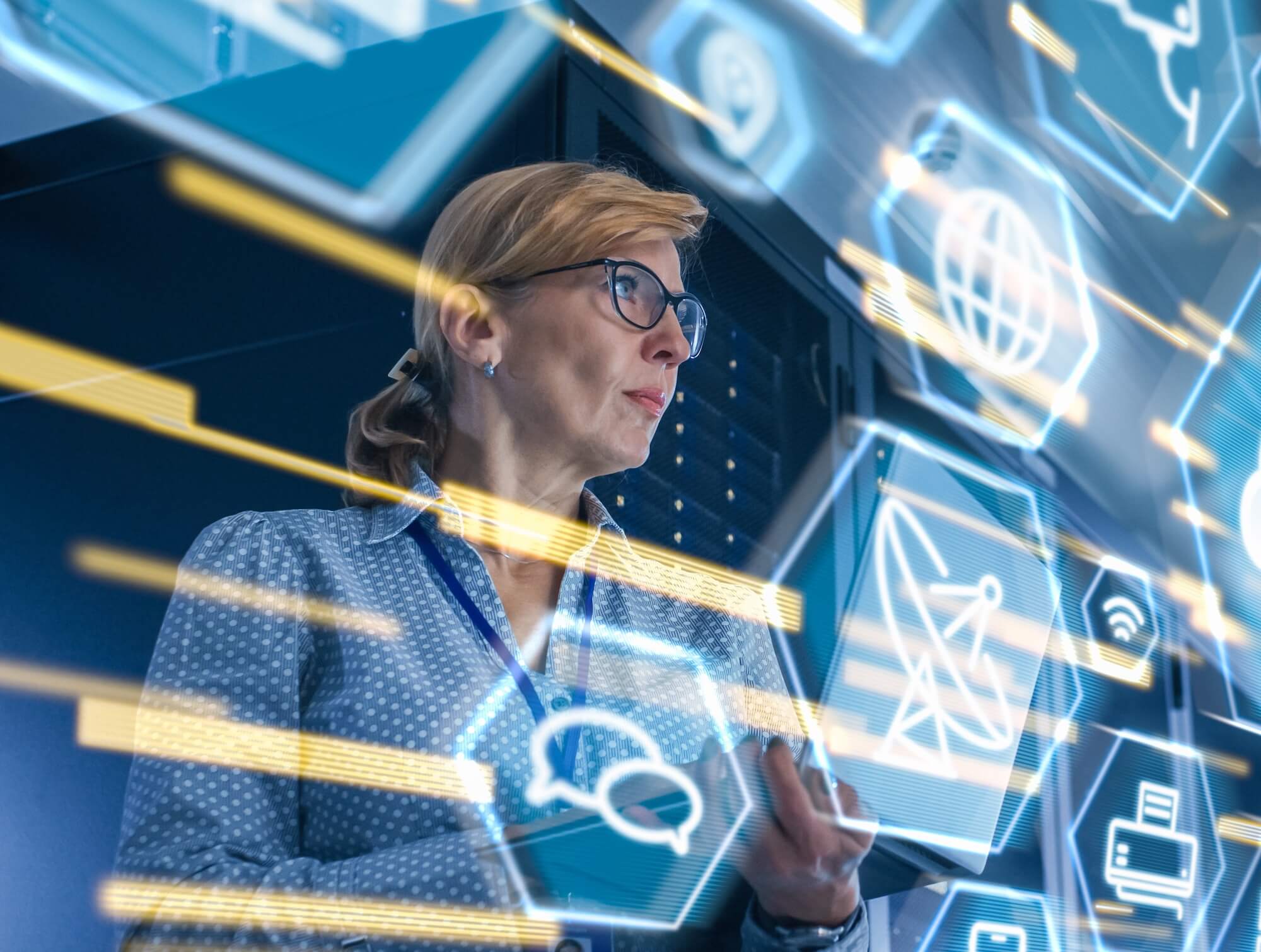 A woman reviews data in a data center.